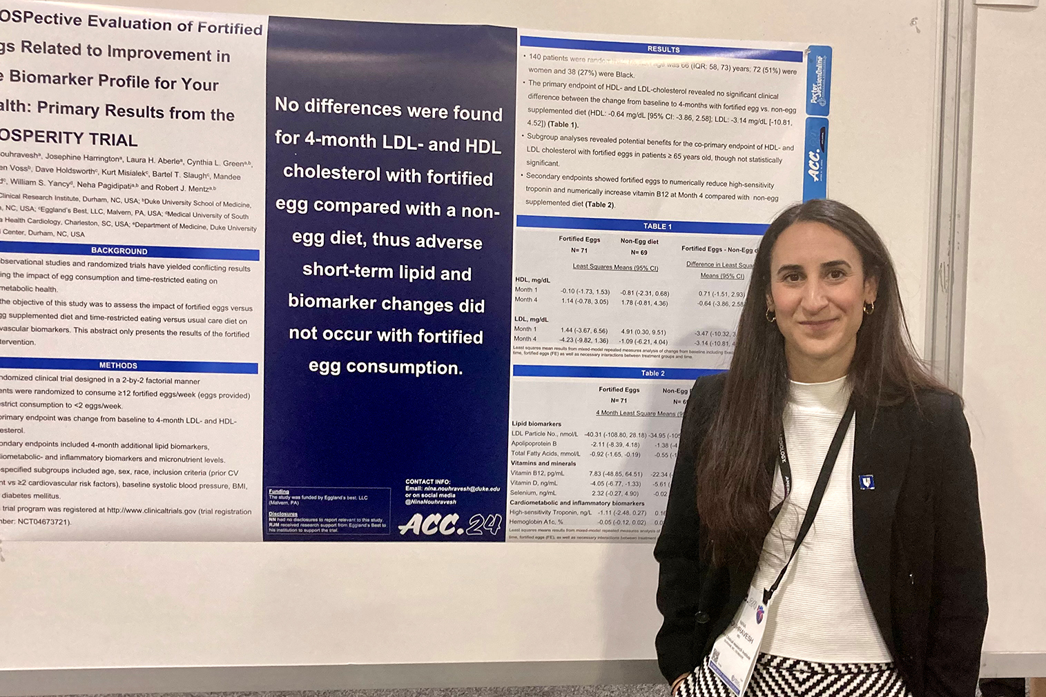 DCRI fellow Nina Nouhravesh stands in front of a poster displaying results of a study on fortified eggs. 