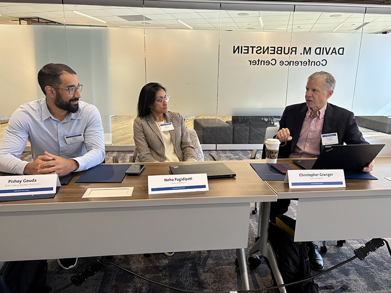 DCRI implementation science experts Chris Granger, Neha Pagidipati, and Pishoy Gouda speak with partners during the 2025 Implementation Science Summit in Washington, DC.
