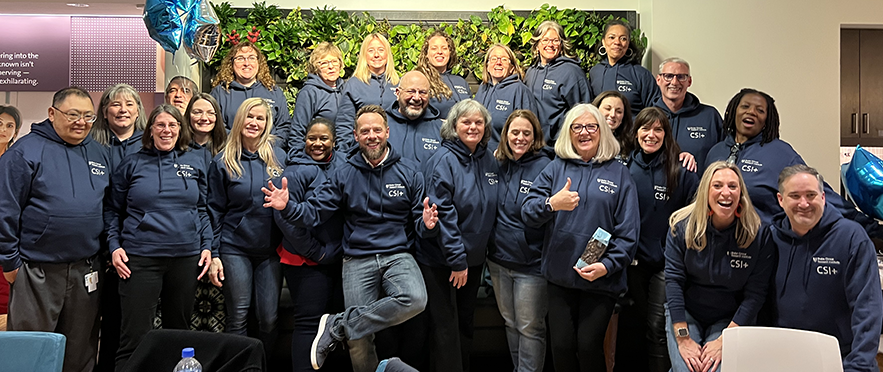 The CSI+ team at the DCRI pose for a group photo while showing off their new team swag.