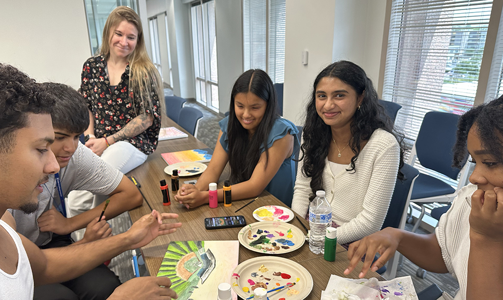 Students in the STAR Program participate in a creative painting activity as part of their team building exercises.