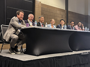 Califf laughs along with his fellow panel members at AHA25