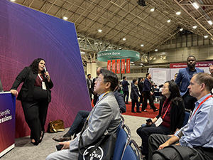 Allison Levin answers questions during a moderated poster session at AHA25
