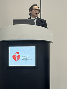 Jonathan Piccini presents from a podium at AHA25