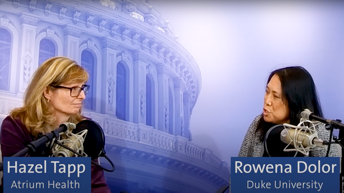 Hazel Tapp and Rowena Dolor sit next to one another with microphones in front of them as they discuss the challenges of integrating research into primary care.