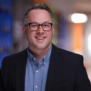 A headshot of Ethan Fricklas